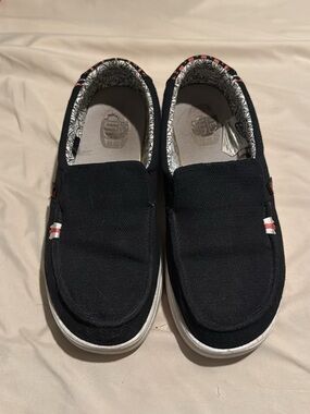 Hey Dude Black Canvas Slip-Ons with White Soles and Red Accents
